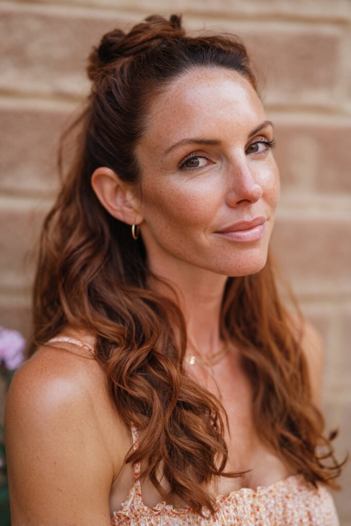 woman with half up half down hairstyle