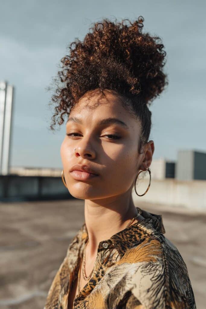 woman with high curly puff, voluminous natural curls