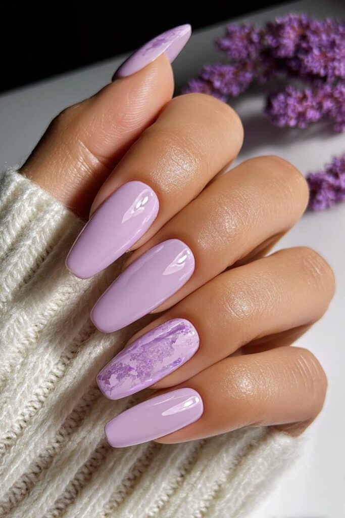 Soft lavender nails with subtle shimmer finish.