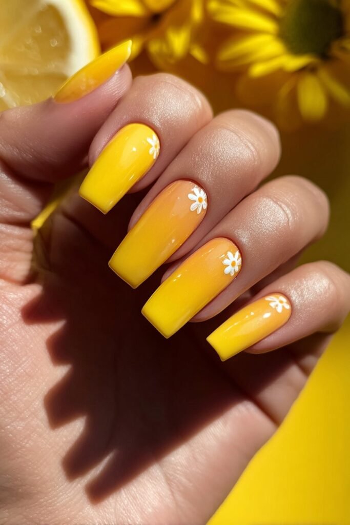 Bright yellow square nails with tiny lemon slice details.