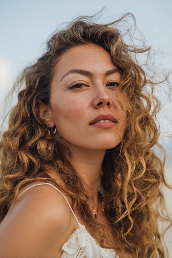 woman with loose romantic curls hairstyle