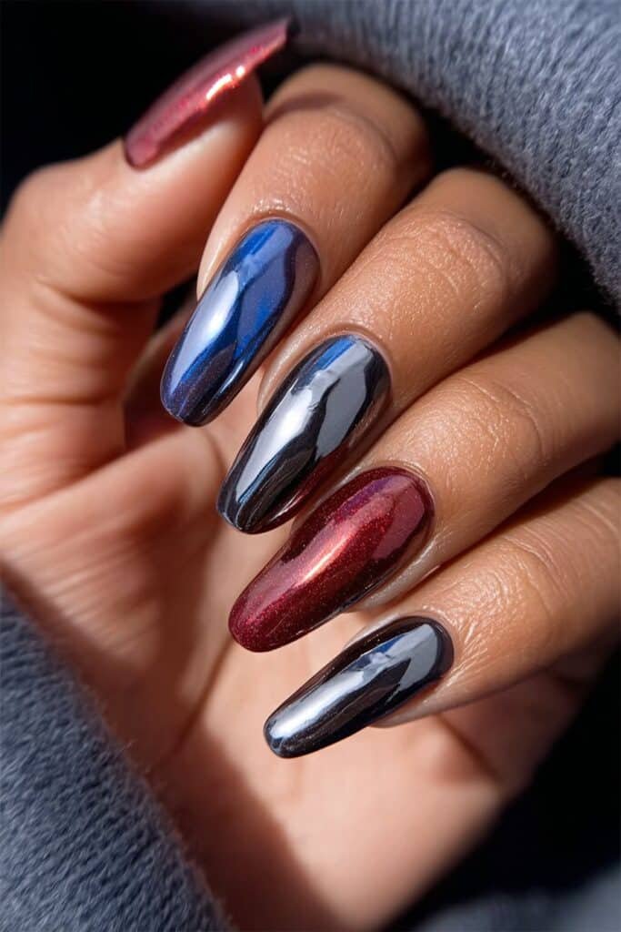 Metallic patriotic nails with chrome red, blue, and silver finish.