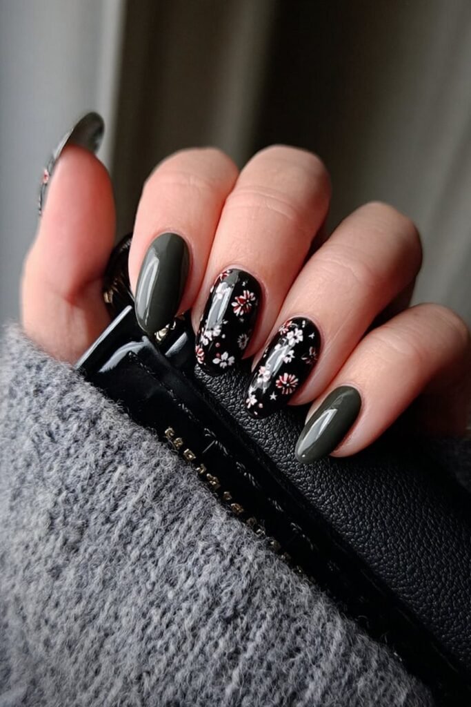 Dark floral Taurus nails in green, plum, and black shades.