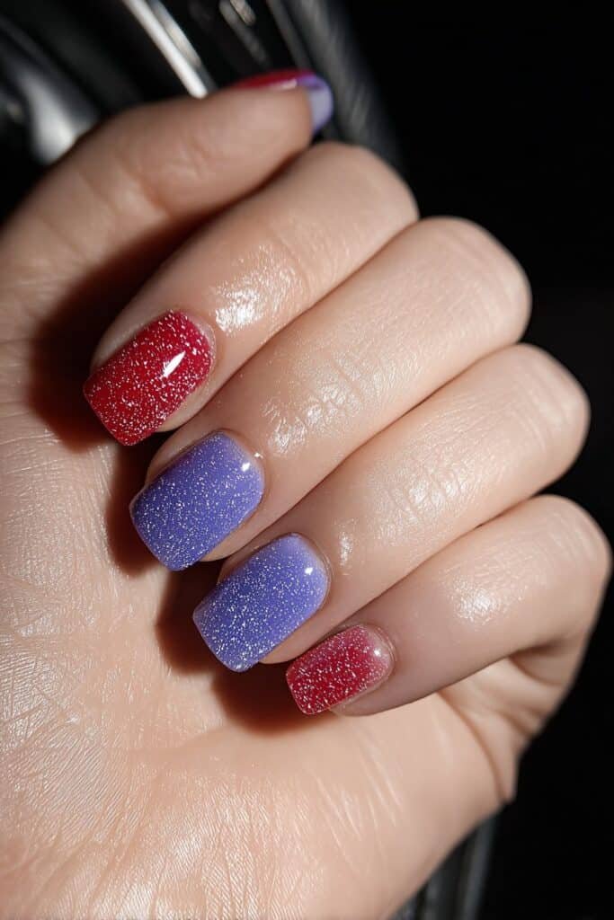 Neon patriotic nails in bright red, blue, and white shades.
