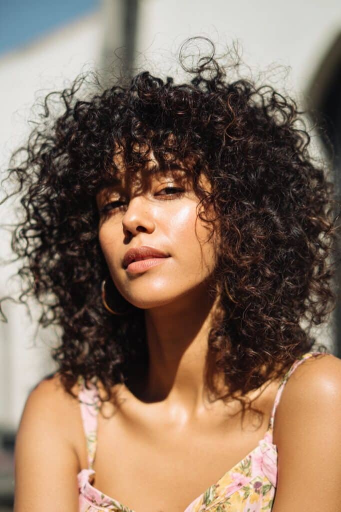 woman with glossy ringlet curls hairstyle