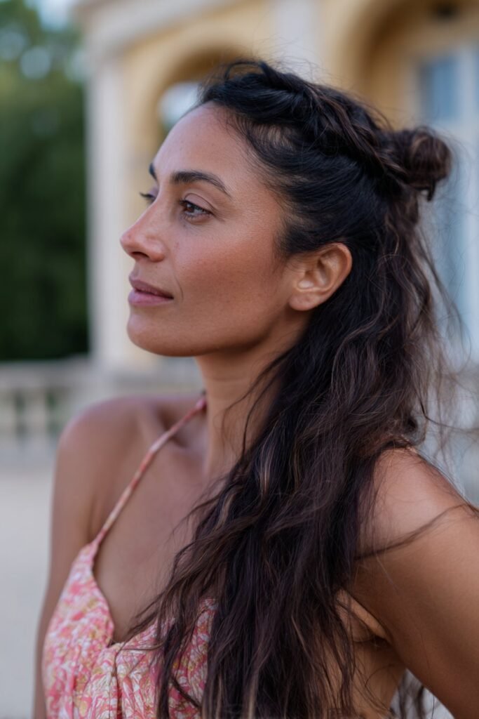 woman with half-up twist hairstyle, soft romantic waves