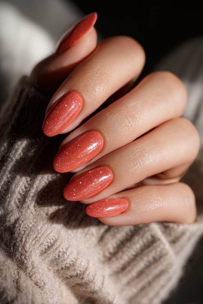 Coral ombre Taurus nails with warm sunset-inspired tones.
