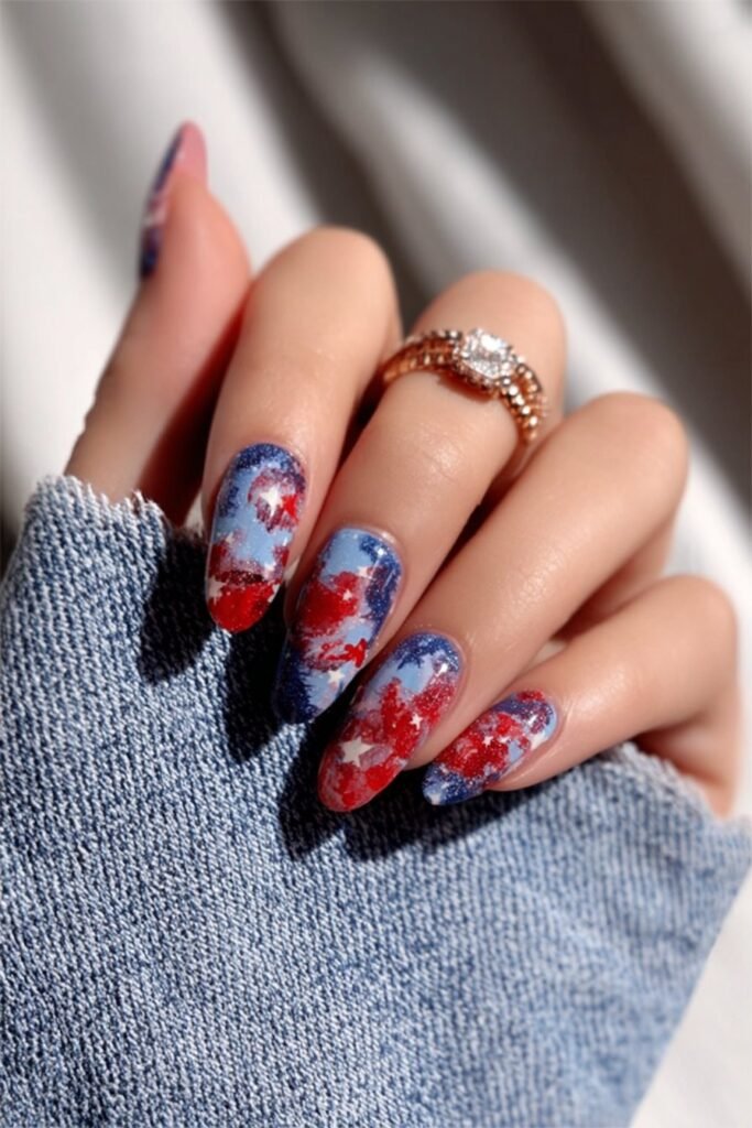 Watercolor patriotic nails inspired by American flag colors.