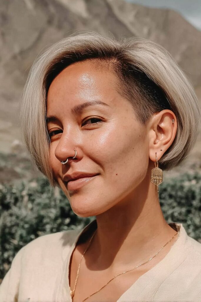 Blunt cut with hidden undercut nape hairstyle.