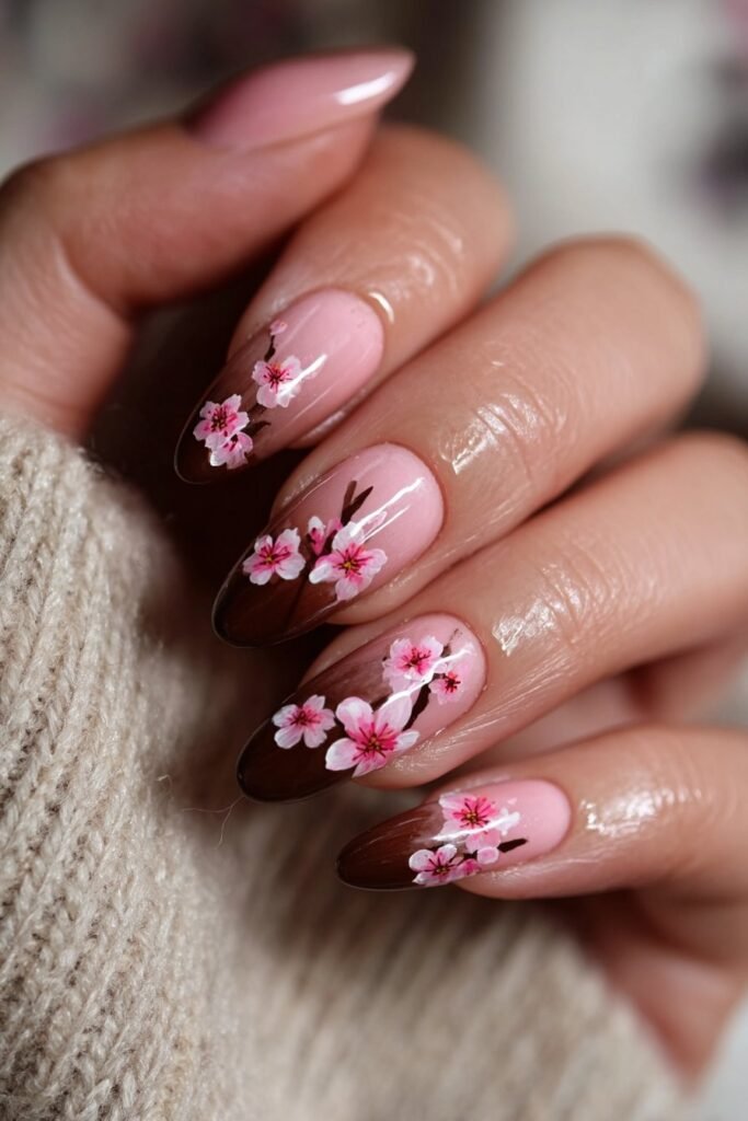 Cherry blossom nails on a soft pink ombre background.