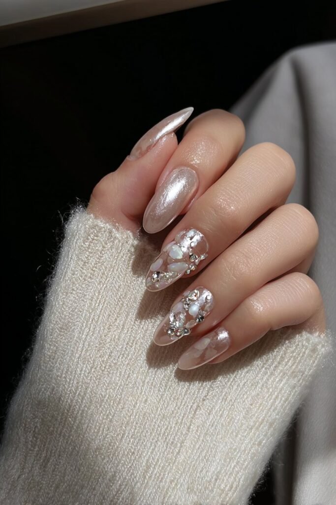 Moonstone-inspired nails with iridescent shimmer and crystals.
