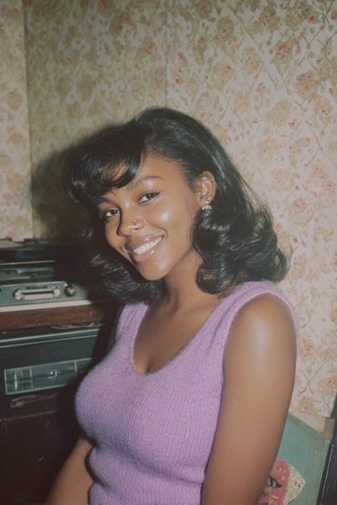 Black woman with a doo-wop flip hairstyle