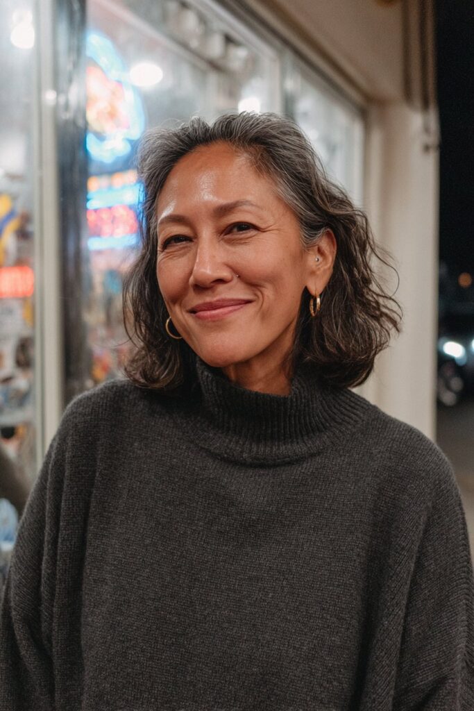 Woman with a shoulder length lob and subtle dark brown layers.
