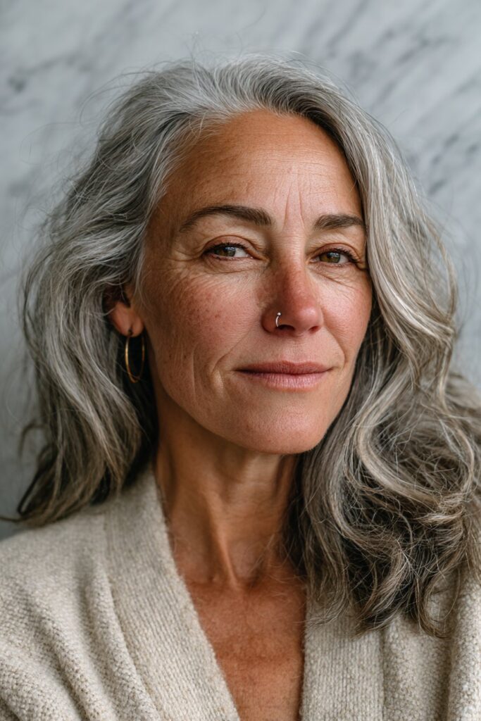 Soft layered cut for fine gray hair on a smiling woman