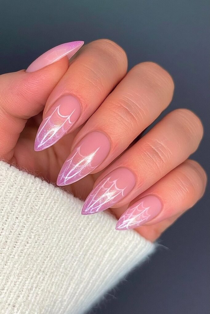 Barbie pink nails with Spider-Gwen inspired web art.