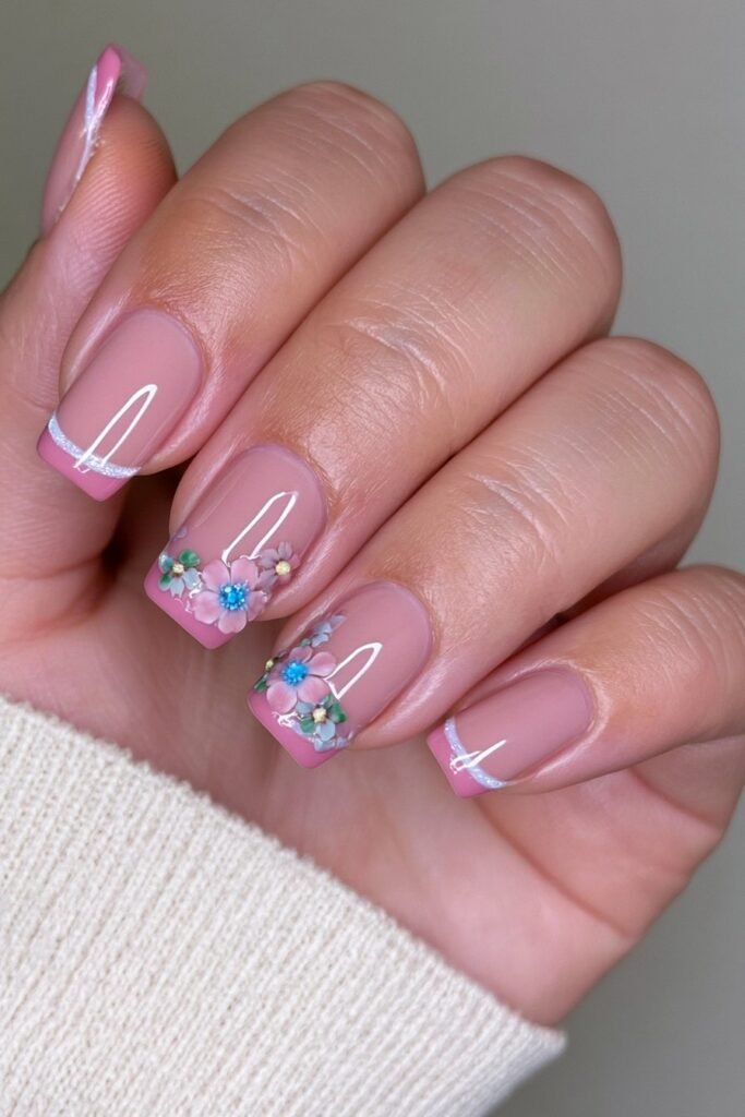 Neutral autumn nails with delicate 3D blooming flower accents.