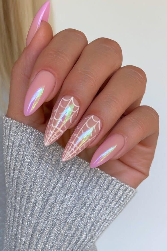 Bubblegum pink nails with playful spider web details.
