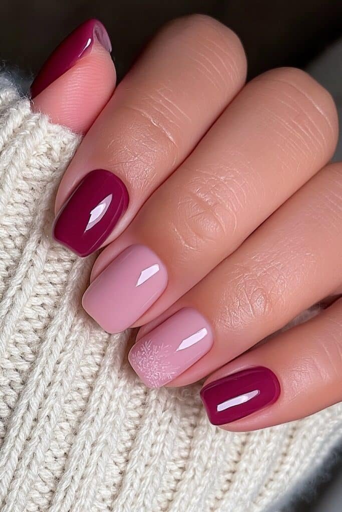 Short burgundy nails with a rich glossy finish.