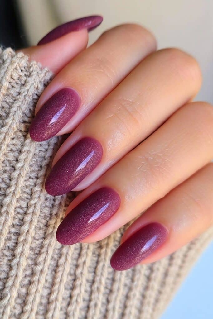 Short burgundy nails with a soft velvet matte finish.
