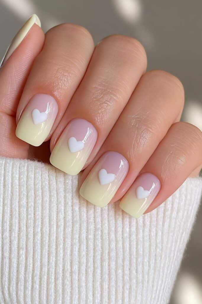 Warm nude and caramel nails with a glossy butter yellow accent.