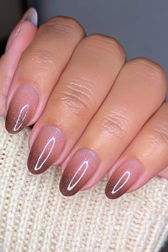 Short oval nails with smooth caramel to chocolate brown ombré