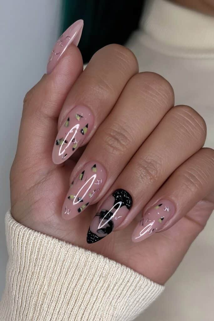Yellow pencil nails paired with black chalkboard accent nails.