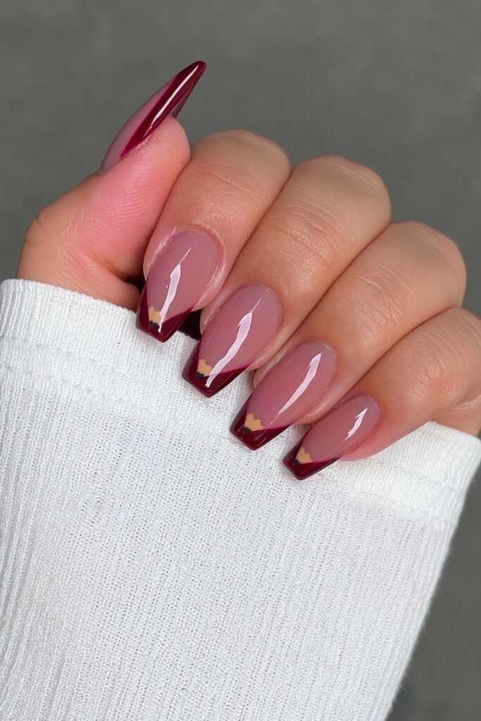 Nude nails with yellow pencils and cherry-red eraser accents.