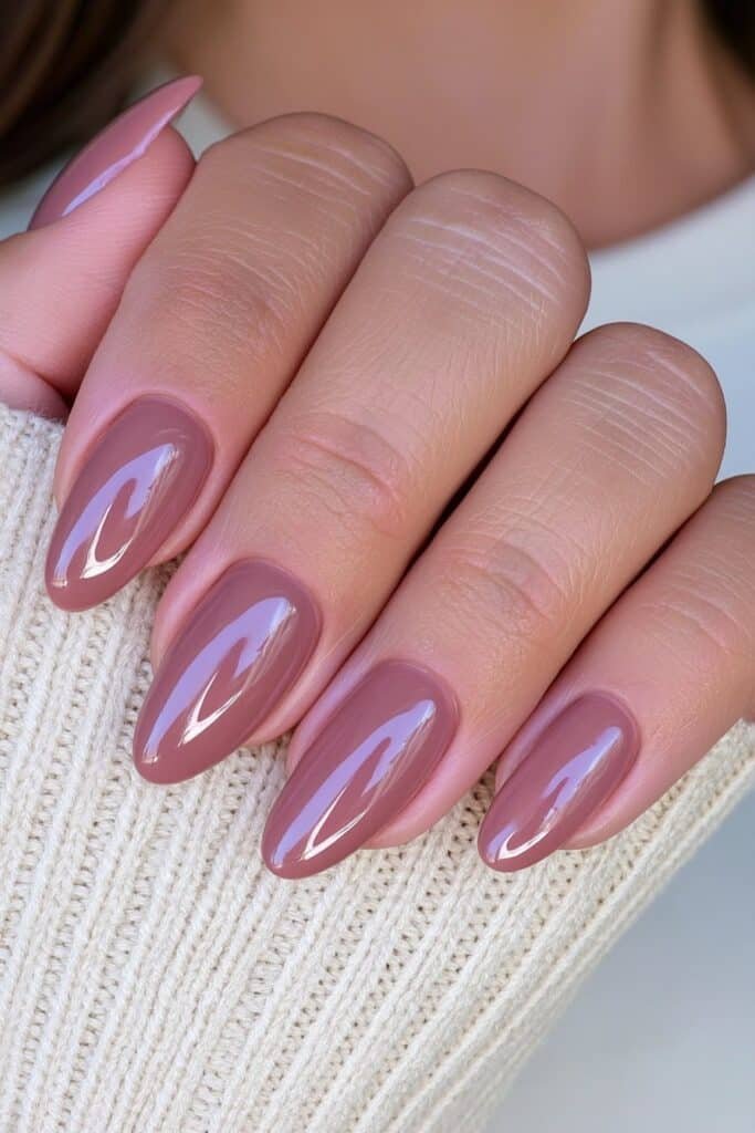 Short chocolate brown almond nails with glossy shine.