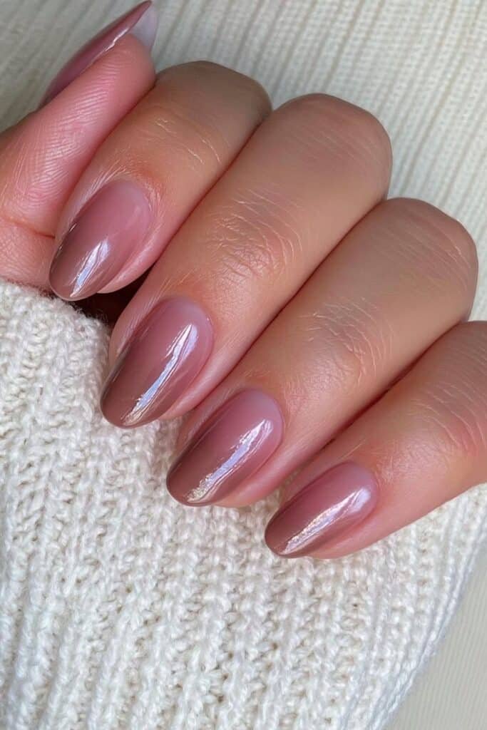 Short chocolate glazed nails with a glossy finish.