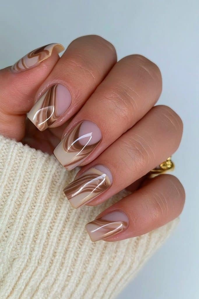 Short squoval nails with cinnamon and cocoa marble swirls