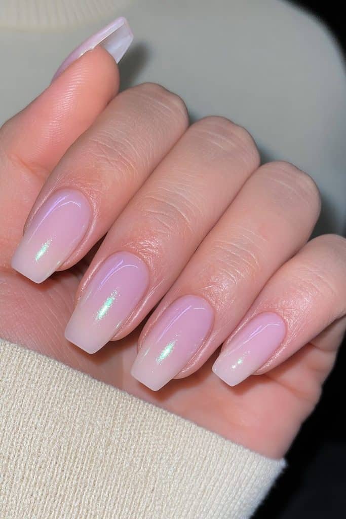 Short almond nails in creamy chocolate brown with a glossy glazed chrome finish.