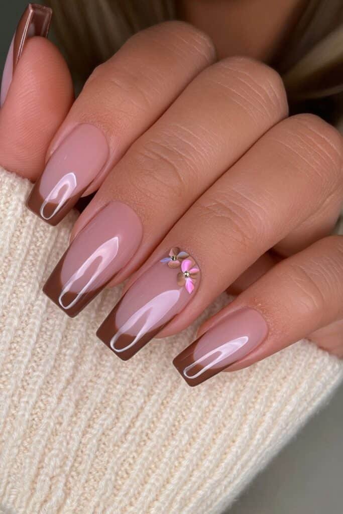 Short squoval nude nails with rich cocoa brown French tips and glossy shine.