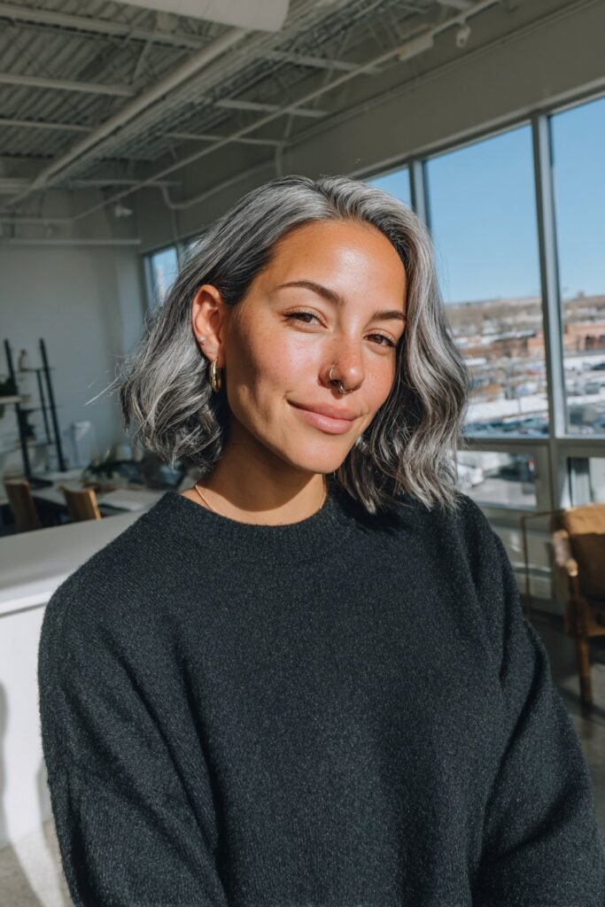 Dark hair with icy platinum highlights creating bold modern contrast.