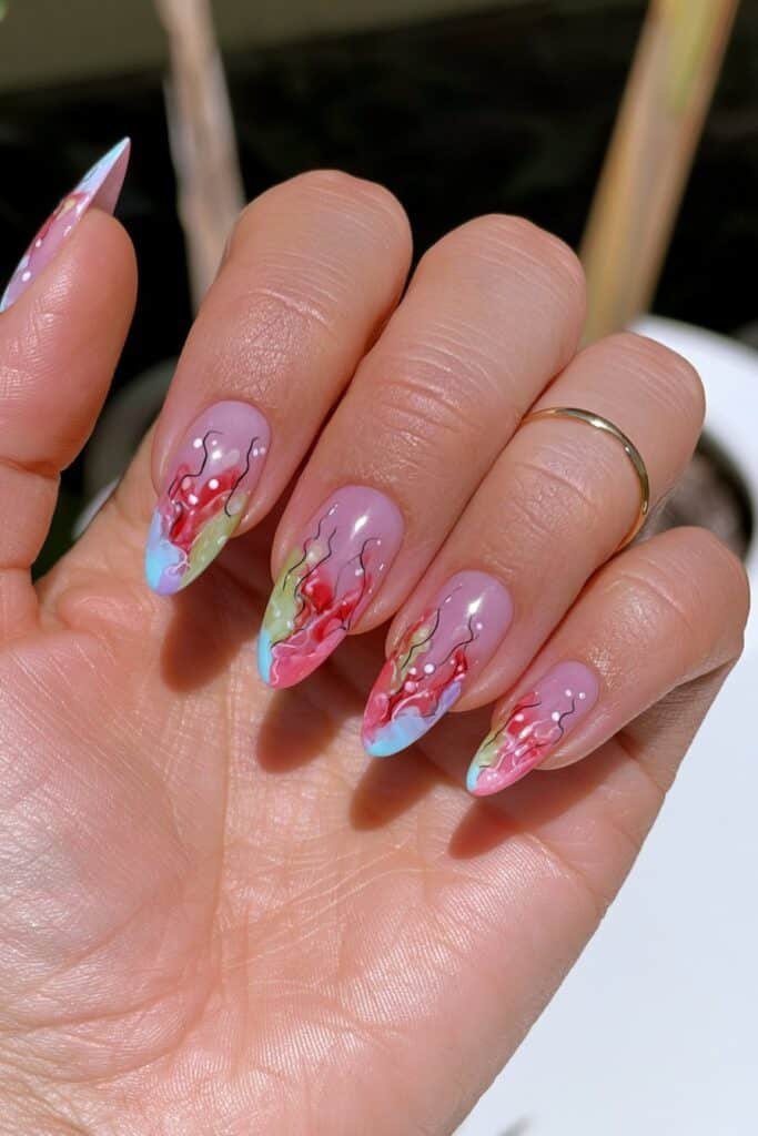 Nails featuring colorful hand-painted pencil illustrations.