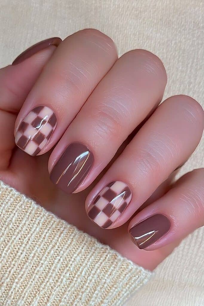 Short round nails with creamy ivory and cocoa brown checkerboard design