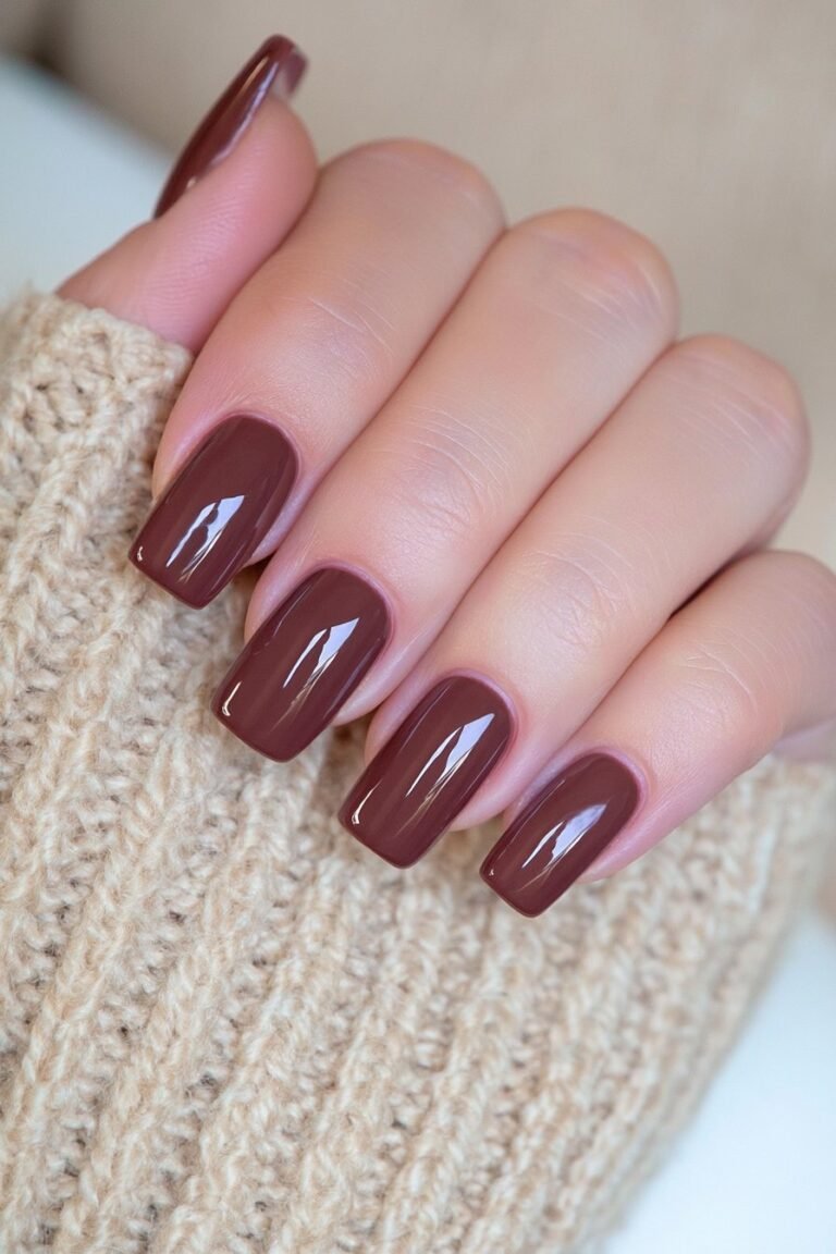 Short square deep chocolate brown nails with rich opaque coverage and mirror-gloss shine.