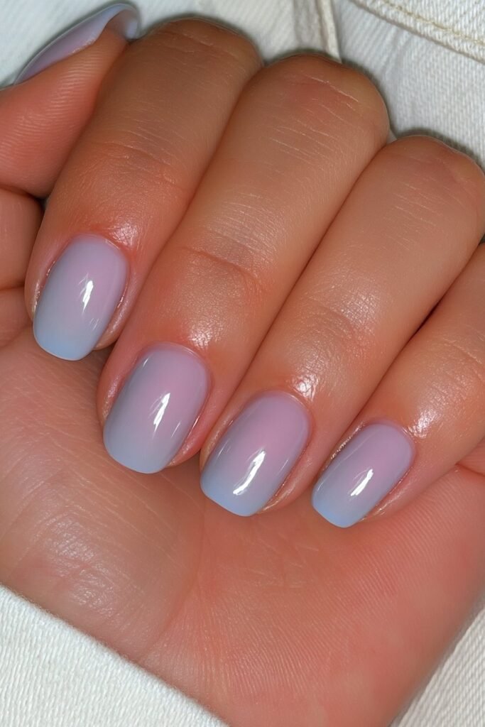 Short classic denim blue nails with a glossy finish.