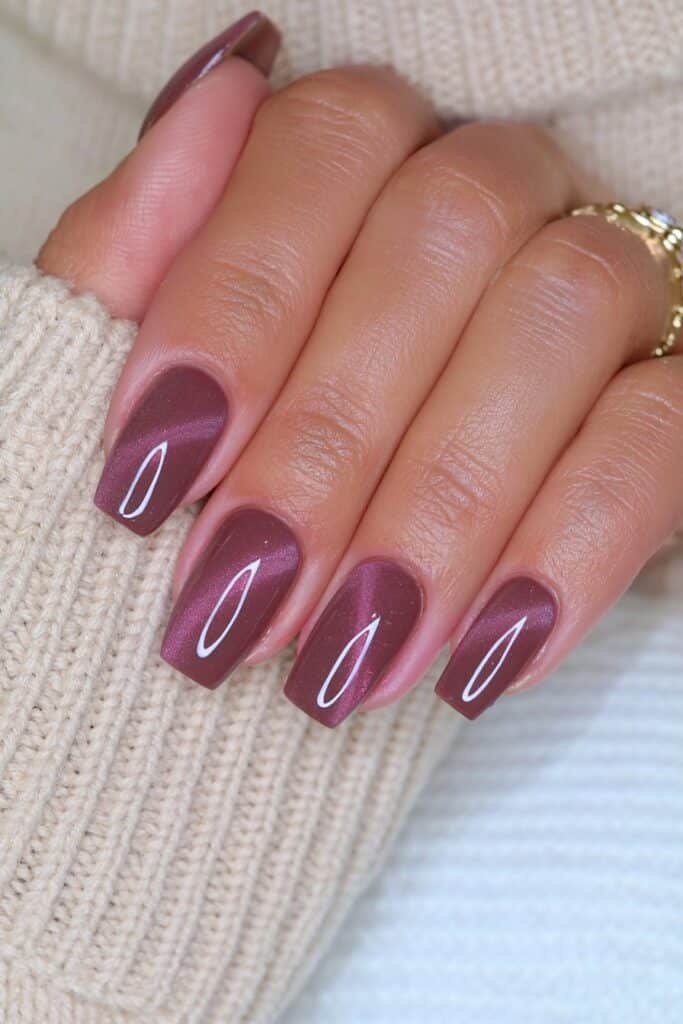 Short coffin espresso brown nails with dimensional magnetic cat-eye shimmer.