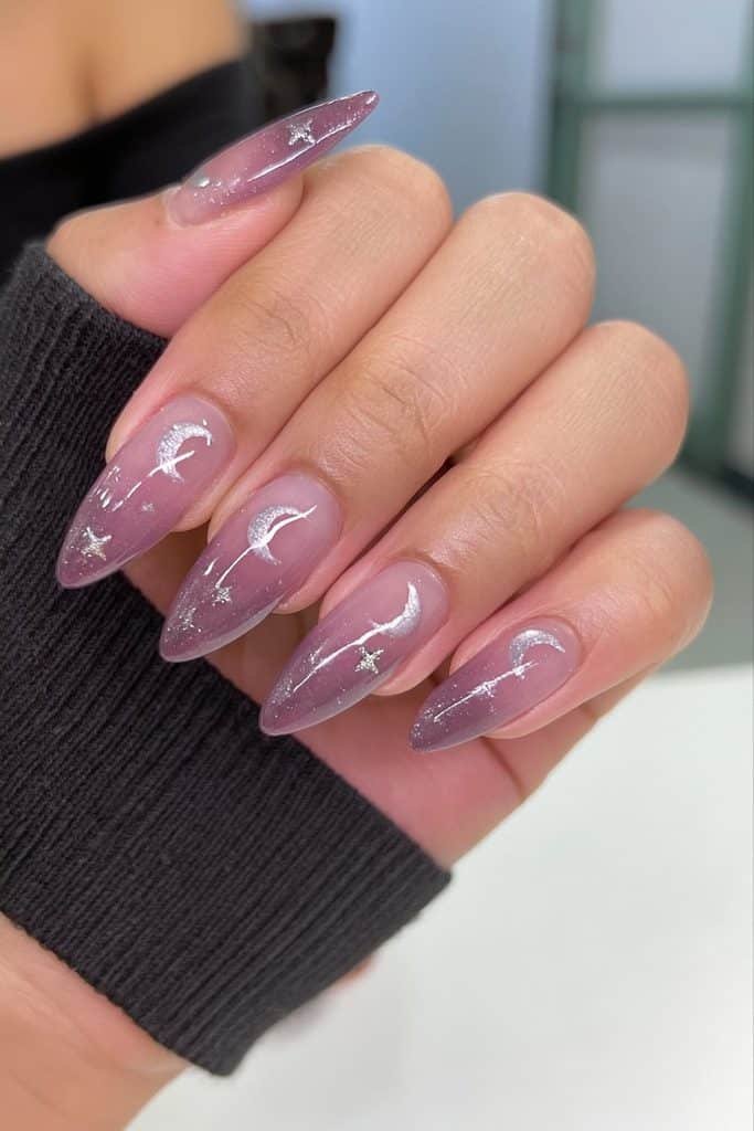Short midnight-purple almond nails with moons and delicate silver stars.