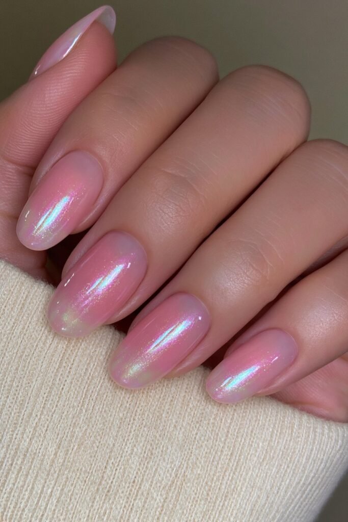 Short translucent coral jelly nails with glazed shine.