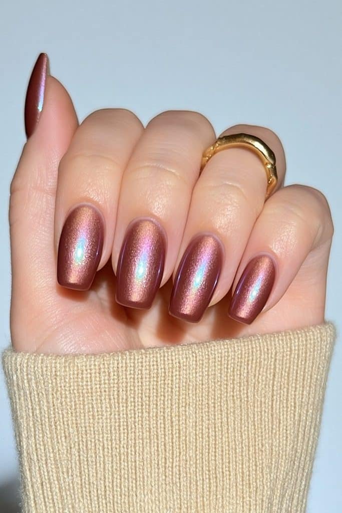 Short squoval nails in creamy mocha velvet with a luminous glazed finish.