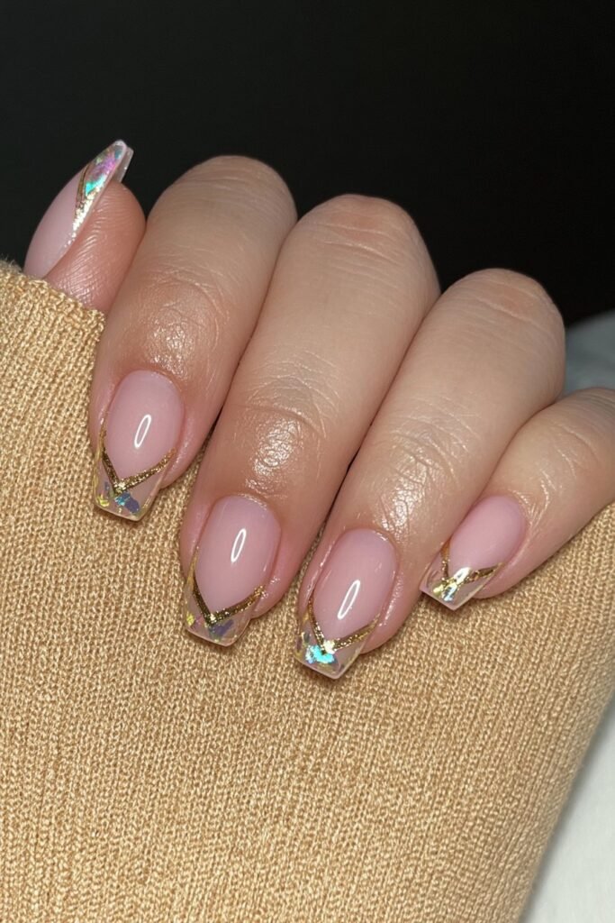 Creamy nude nails with thin molten gold chrome accents.