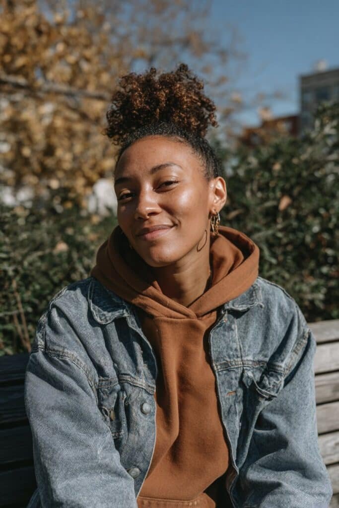 Black woman wearing a voluminous high natural puff styled