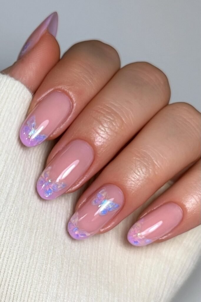 Short nude nails with iridescent butterfly accents.