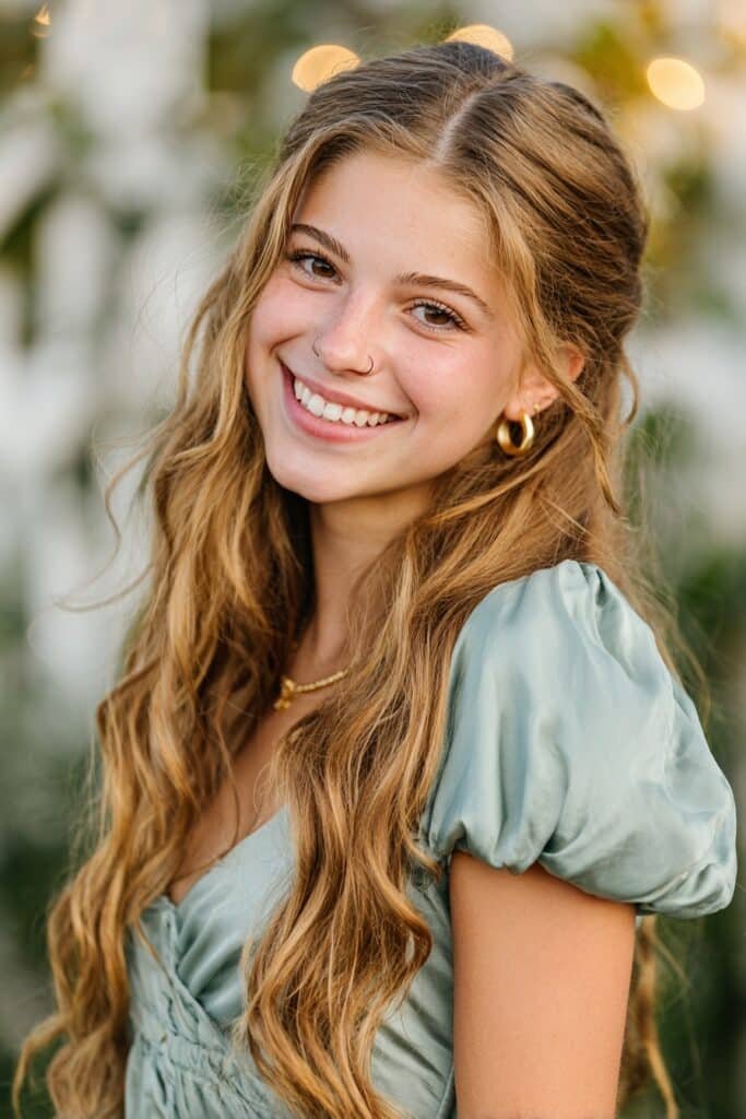 Long loose beach waves with soft texture, glossy shine, and effortless movement for a timeless homecoming hairstyle.