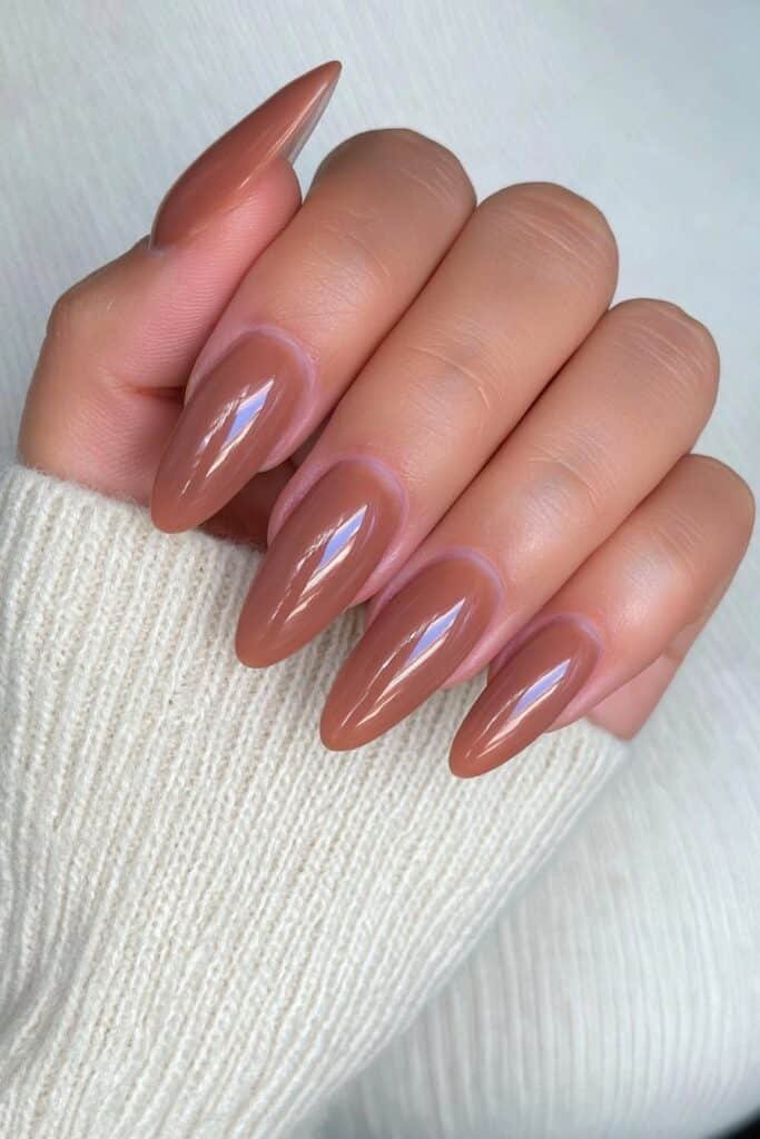 Warm caramel almond nails with a smooth soft-matte finish.