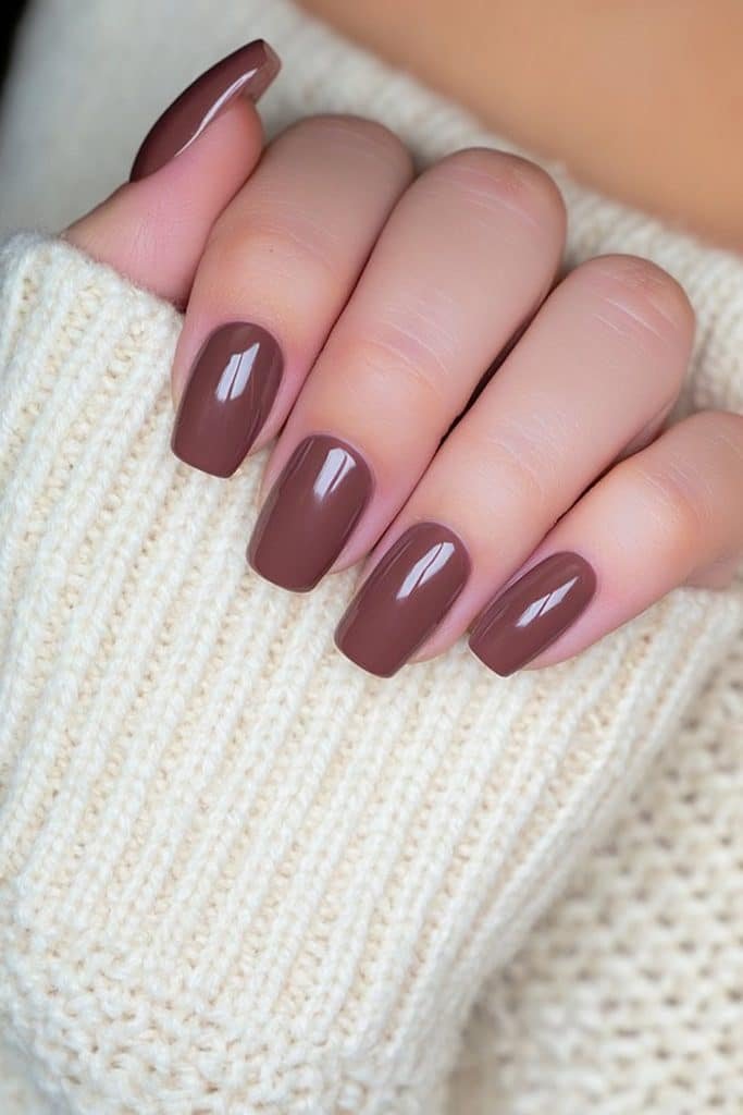 Short round Thanksgiving nails in deep chocolate brown with a soft matte finish.