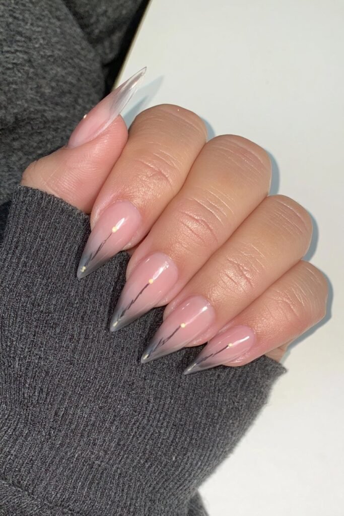 Nude nails with grey pencil-line sketches and glossy accents.