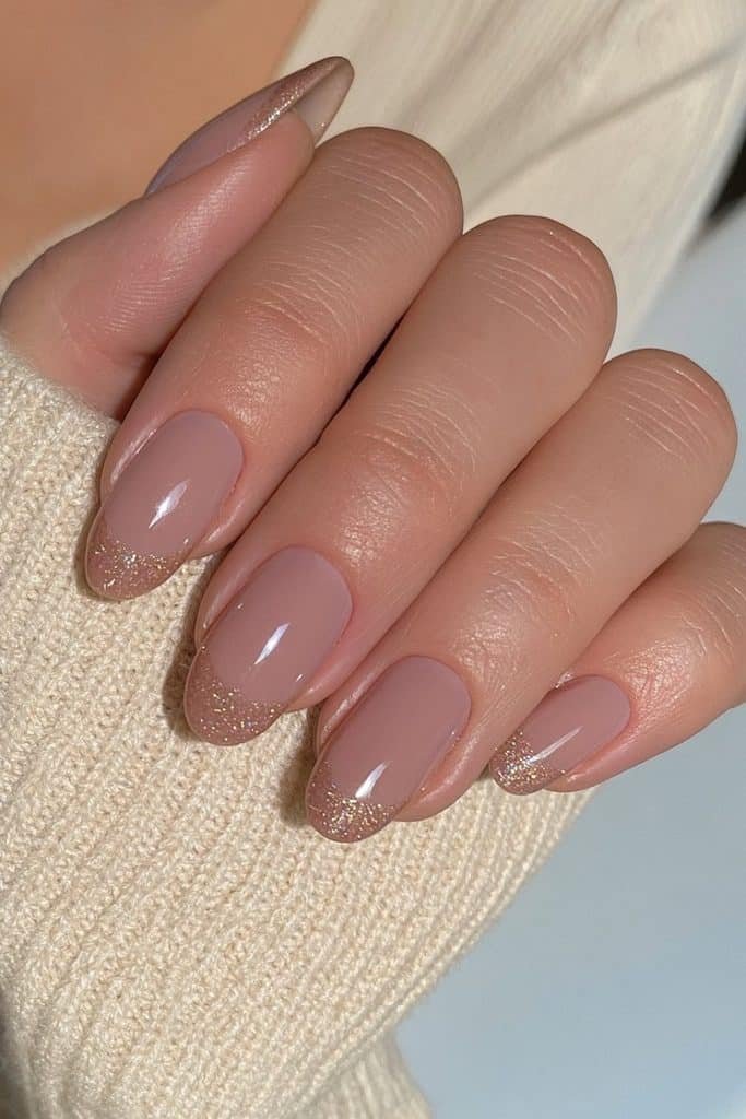 Short oval nails in soft milk chocolate with a translucent milky gel finish