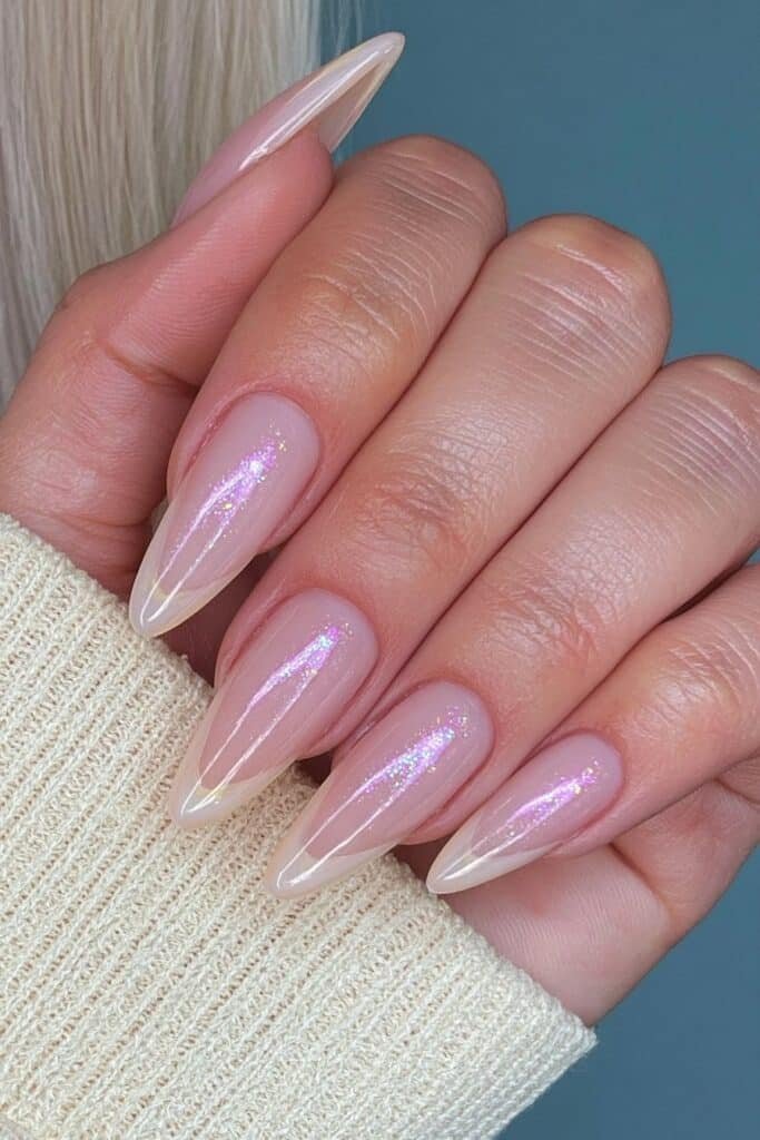 Milky white nails with subtle glitters inspired tips.